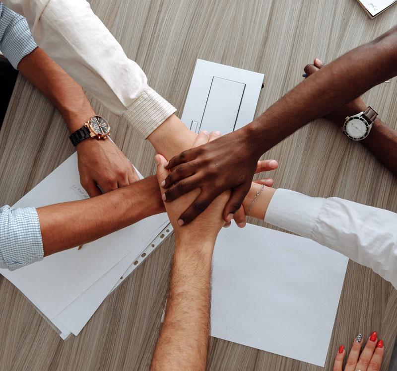 Image shows hands in a circle.